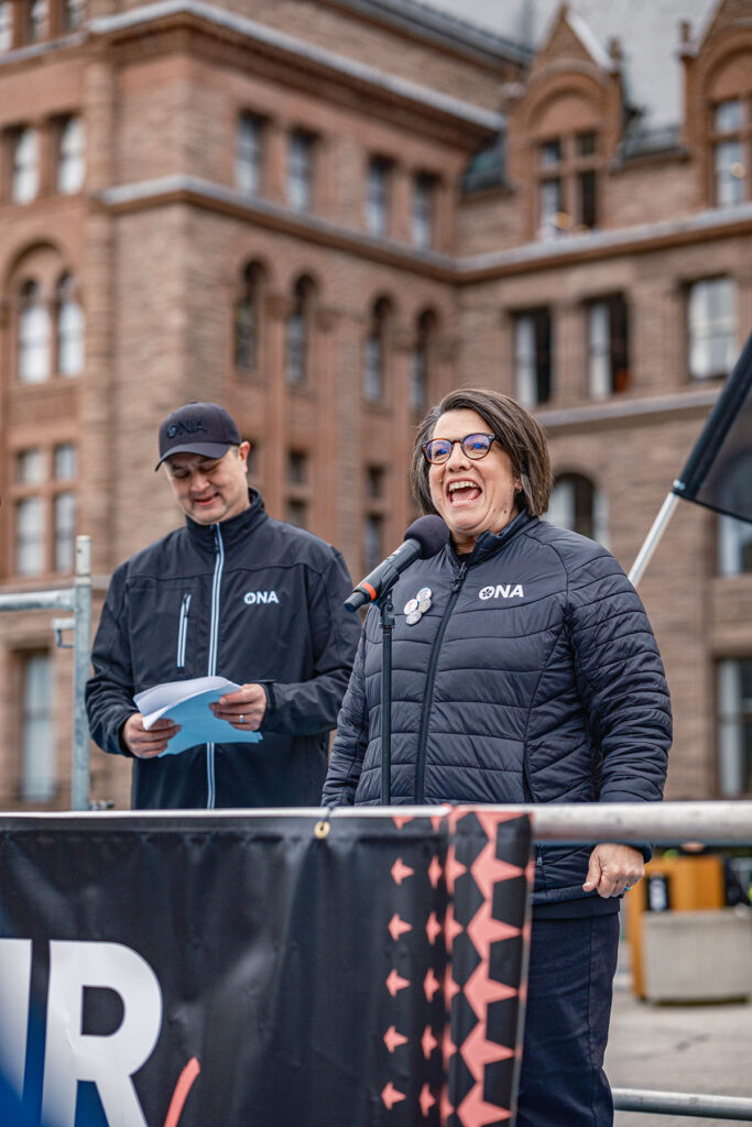 ONA Provincial President Erin Ariss and First Vice-President Alan Warrington address crowd from a flatback truck at rally.