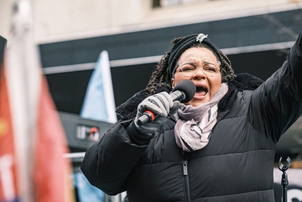 SEIU Healthcare Executive Vice-President Jackie Walker motivates the crowd from flatbed truck.