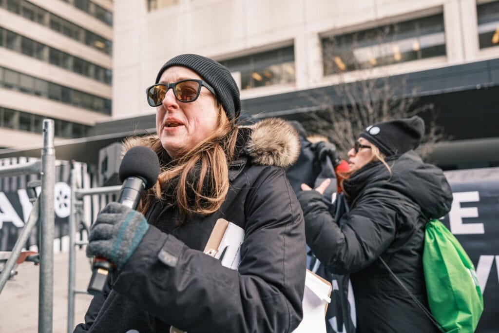 Region 4 Vice-President Grace Pierias speaks into microphone.