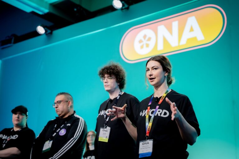 Four people speak from onstage at an ONA event.