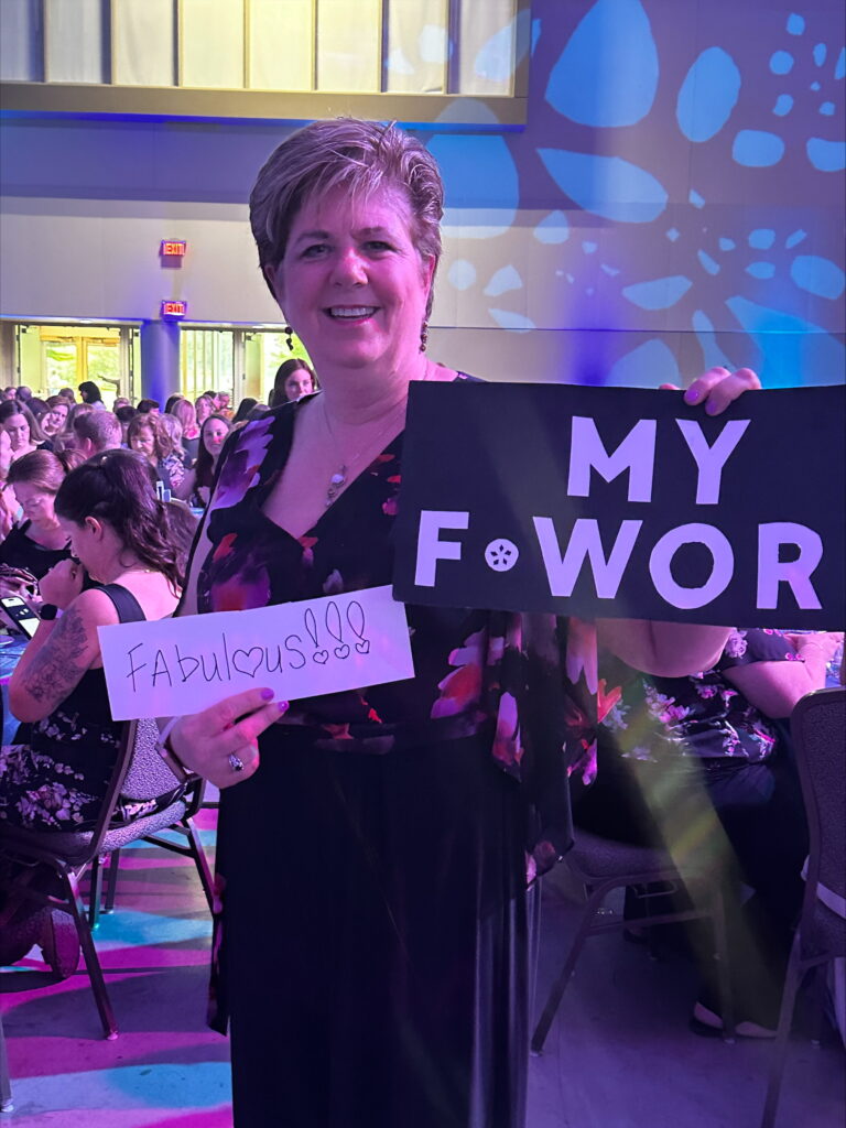 An ONA member holds a sign reading, “Fabulous!”