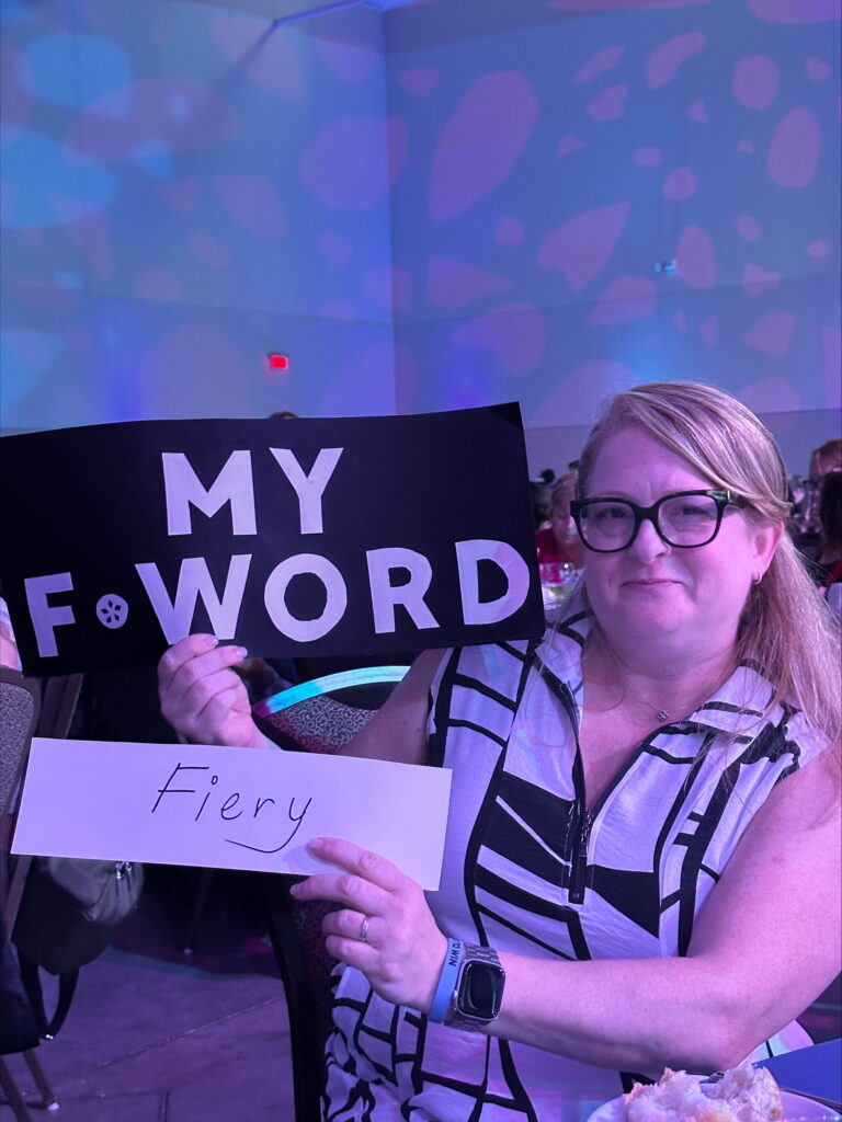 An ONA member holds a sign reading, “Fiery.”