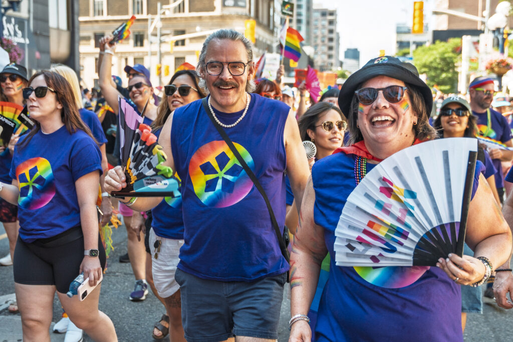 ONA President Erin Ariss marches in the parade with a group of members.