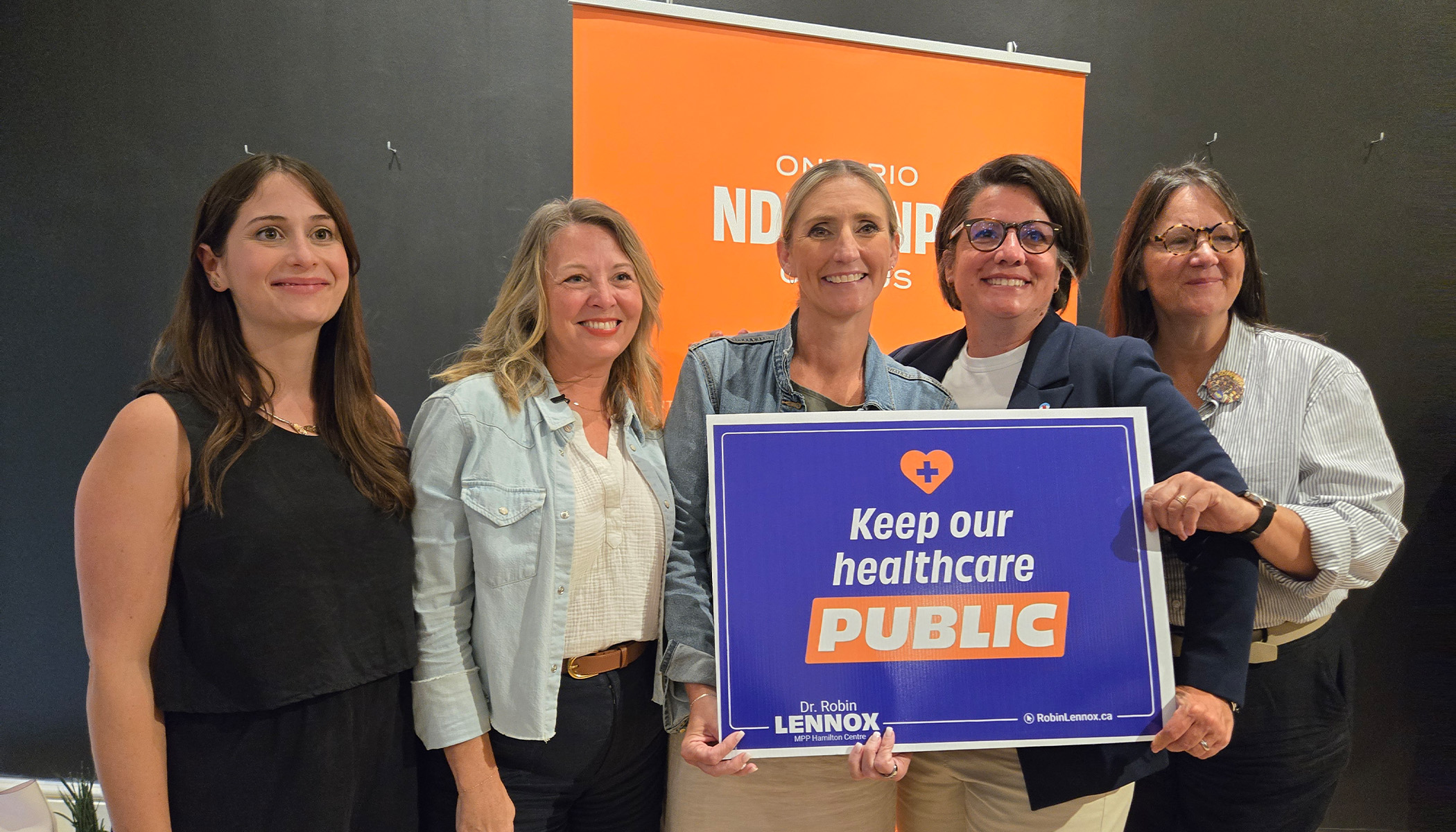 ONA President Erin Ariss stands in a row with MPP Robin Lennox (Hamilton Centre), Ontario NDP Leader Marit Styles, OFL President Laura Walton and MPP Sandy Shaw (Hamiton West-Ancaster-Dundas).