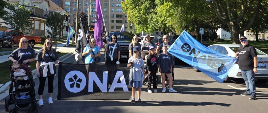 A group of ONA members pose for the camera while marching in the Labour Day parade.
