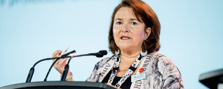 CFNU President Linda Silas, RN, speaking at the podium.