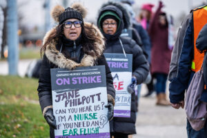 Member wears sign on picket line.
