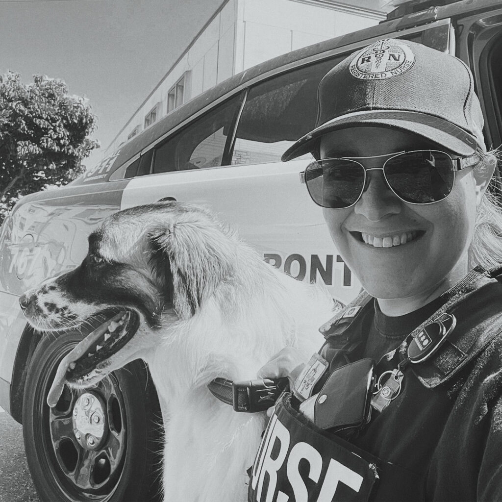 ONA member Melissa Mosneanu poses with a dog.