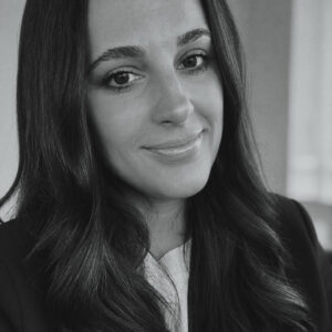 Headshot of woman with long dark hair.