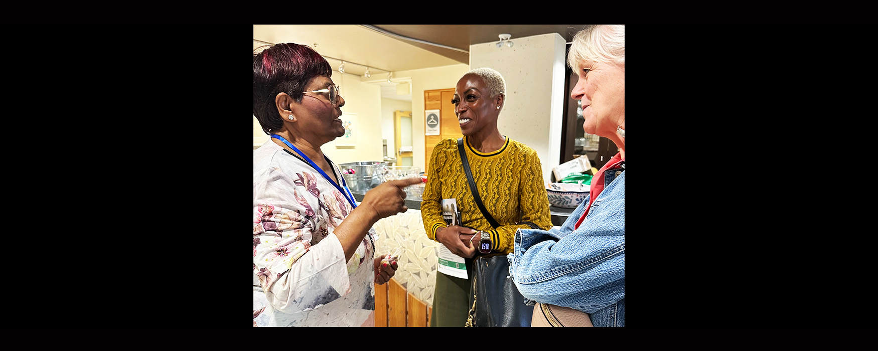 Region 3 Vice-President Karen McKay-Eden and ONA Member Education/Anti‑Racism and Anti‑Oppression Senior Manager Kieran Maxwell talk to a member.