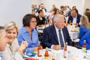 ONA Provincial President Erin Ariss has a determined look on her face as she sits next to Ontario Premier Doug Ford.