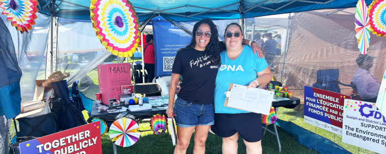 Guelph General Hospital political action rep Liz Lima stands beside Bargaining Unit President Maggie Jarvis holding ONA petitions.